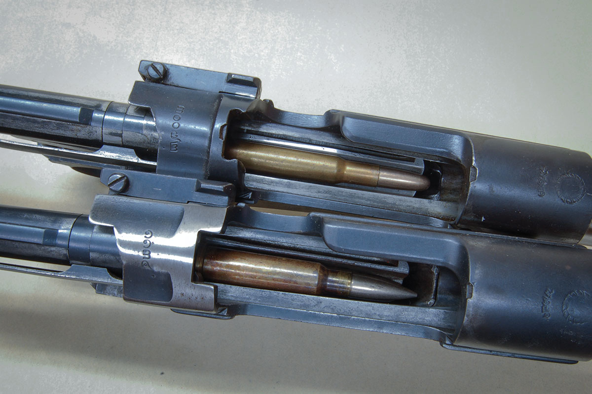 Siamese actions with a 30-40 Krag (top) and a 8x52Rmm (bottom) in magazines.